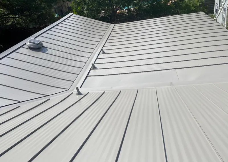 Solar attic fan installed on a metal roof for Roof Ventilation in Upper Arlington